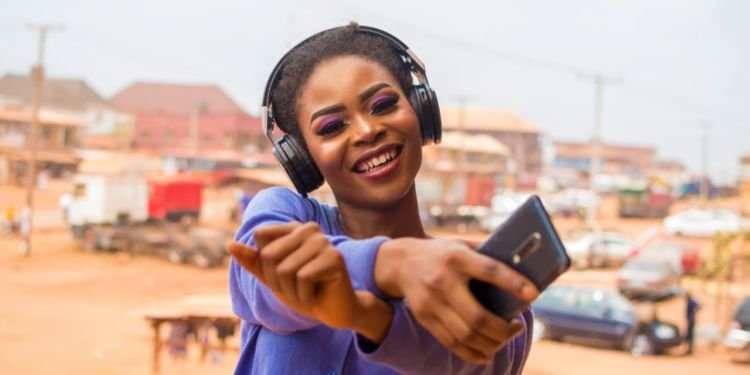 Happy African Woman Listening To Music
