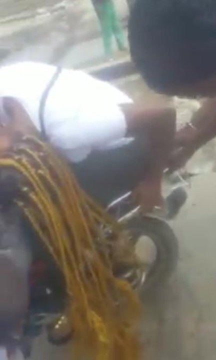 Lady In Pains As Her Long Braids Gets Stuck On Motorcycle Wheels