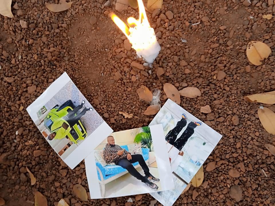 Mysterious Lady Burns Candle On Hushpuppi'S Picture (See Pics) Mysterious Lady Burns Candle On Hushpuppi'S Picture (See Pics)