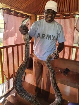 Buratai Flexes With Snake Amidst Insecurity Woes (Pic)