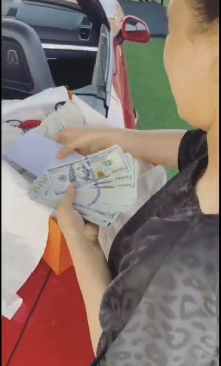 Didi Shows Off Dollars And Bag She Got As Gift From Dbanj